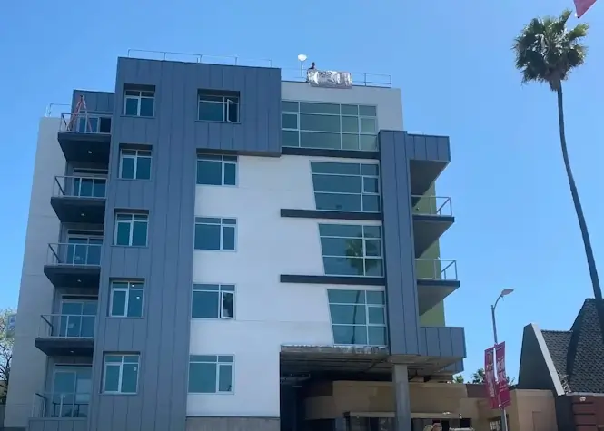 An apartment with metal seam panels on the walls.