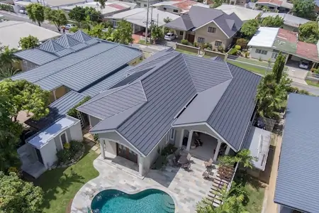 A Bermuda style roof on a suburban building.