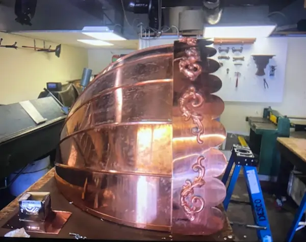 A copper overhang that is under the process of being fabricated.