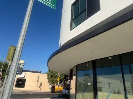 Black seamed fascia that wraps around a building.