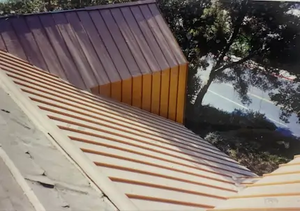 A top view of a metal roof that is under construction.