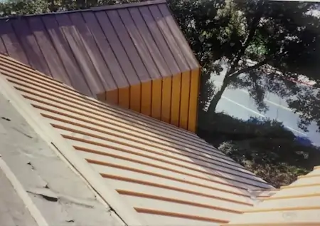 A brown metal roof with pencil ribs.
