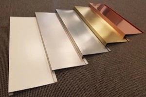 A collection of sheet metal pnaels that vary in color and length.